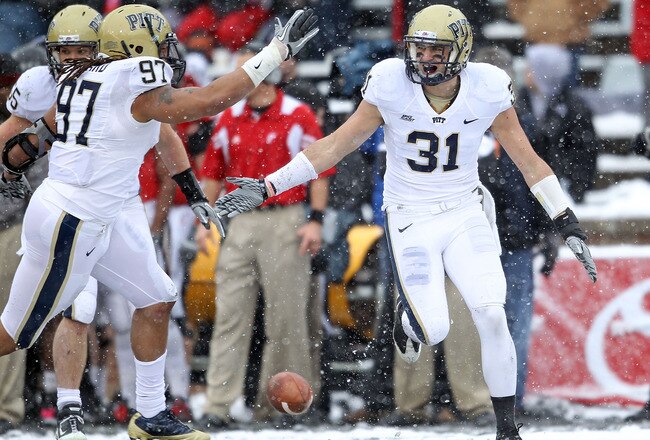 CINCINNATI, OH - DECEMBER 04:  Dom Decicco #31 of the Pittsburgh Panthers celebrates with Jabaal Sheard #97 after intercepting a pass during the Big East Conference game against the Cincinnati Bearcats at Nippert Stadium on December 4, 2010 in Cincinnati,
