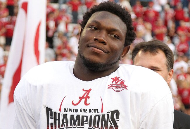 ORLANDO, FL - JANUARY 01:  Courtney Upshaw #41 of the Alabama Crimson Tide accepts the MVP award after winning the Capitol One Bowl against the Michigan State Spartans at the Florida Citrus Bowl on January 1, 2011 in Orlando, Florida.  (Photo by Mike Ehrm
