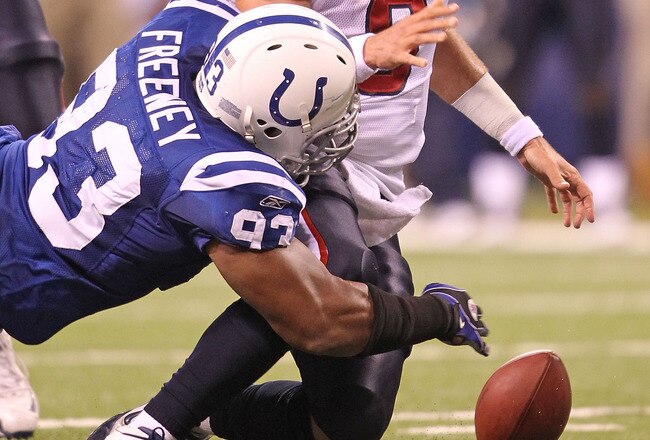 INDIANAPOLIS - NOVEMBER 01:  Matt Schaub #8 of Houston Texans fumbles the ball while being tackled  by Dwight Freeney #93 of the Indianapolis Colts during the NFL game at Lucas Oil Stadium on November 1, 2010 in Indianapolis, Indiana.  (Photo by Andy Lyon