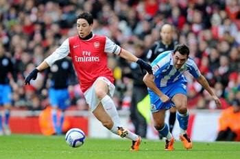 LONDON, ENGLAND - JANUARY 30:  Samir Nasri of Arsenal goes past Gary Roberts of Huddersfield during the FA Cup sponsored by E.ON fourth round match between Arsenal and Huddersfield Town at The Emirates Stadium on January 30, 2011 in London, England.  (Pho