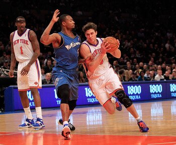 NEW YORK, NY - JANUARY 24: Danilo Gallinari #8 of the New York Knicks drives past Rashard Lewis #9 of the Washington Wizards at Madison Square Garden on January 24, 2011 in New York City. NOTE TO USER: User expressly acknowledges and agrees that, by downl