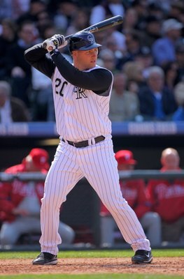DENVER - APRIL 10:  Catcher Chris Iannetta #20 of the Colorado Rockies takes an at bat against the Philadelphia Phillies during MLB action on Opening Day at Coors Field on April 10, 2009 in Denver, Colorado. The Rockies defeated the Phillies 10-3.  (Photo