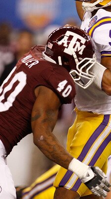 ARLINGTON, TX - JANUARY 07:  Jordan Jefferson #9 of the Louisiana State University Tigers throws under pressure from Von Miller #40 of the Texas A&M Aggies during the AT&T Cotton Bowl at Cowboys Stadium on January 7, 2011 in Arlington, Texas.  (Photo by C