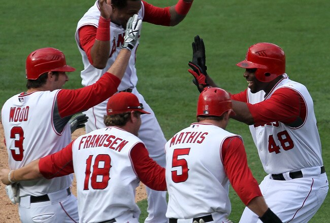 ANAHEIM, CA - SEPTEMBER 29:  Torii Hunter #48 of the Los Angeles Angels of Anaheim is mobbed by Brandon Wood #3, Kevin Frandsen #18, and Jeff Mathis #5 after Hunter's walk off single in the 11th inning ended the game with the Oakland Athletics on Septembe