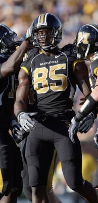 COLUMBIA, MO - NOVEMBER 7:  Aldon Smith #85 of the Missouri Tigers is congratulated by teammates during the game against the Baylor Bears at Faurot Field/Memorial Stadium on November 7, 2009 in Columbia, Missouri. (Photo by Jamie Squire/Getty Images)