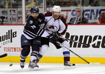 NASHVILLE, TN - FEBRUARY 12:  Peter Forsberg #21 of the Colorado Avalanche skates against Joel Ward #29 of the Nashville Predators on February 12, 2011 at the Bridgestone Arena in Nashville, Tennessee.  (Photo by Frederick Breedon/Getty Images)