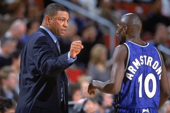 12 Dec 2000:  Head Coach ''Doc'' Rivers of the Orlando Magic talks with player Darrell Armstrong #10 at the sidelines during the game against the Seattle SuperSonics at the Key Arena in Seattle, Washington.  The SuperSonics defeated the Magic 97-92.    NO