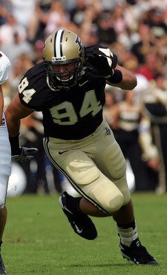 WEST LAFAYETTE, IN - SEPTEMBER 20:  Quarterback Dan LeFevour #13 of the Central Michigan Chippewas runs the ball past Ryan Kerrigan #94 of the Purdue Boilermakers at Ross-Ade Stadium on September 20, 2008 in West Lafayette, Indiana.  (Photo by Ronald Mart