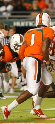 MIAMI, FL - OCTOBER 9: Jermaine Thomas #38 of the Florida State Seminoles eludes the tackle of Brandon Harris #1 of the Miami Hurricanes to score a touchdown on October 9, 2010 at Sun Life Stadium in Miami, Florida. (Photo by Joel Auerbach/Getty Images)