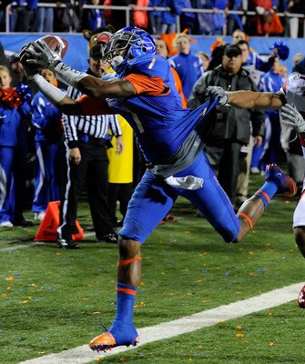 LAS VEGAS, NV - DECEMBER 22:  Titus Young #1 of the Boise State Broncos catches a pass just out of bounds in the end zone in front of Brandon Burton #27 of the Utah Utes during the MAACO Bowl Las Vegas at Sam Boyd Stadium December 22, 2010 in Las Vegas, N