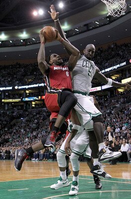 BOSTON - FEBRUARY 13:  LeBron James #6 of the Miami Heat drives  against Kevin Garnett #5 of the Boston Celtics at TD Garden on February 13, 2011 in Boston, Massachusetts. NOTE TO USER: User expressly acknowledges and agrees that, by downloading and/or us