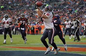 DENVER - DECEMBER 26:  Wide receiver Owen Daniels #91 of the Houston Texas makes a first quarter touchdown reception in front of D.J. Williams #55 of the Denver Broncos at INVESCO Field at Mile High on December 26, 2010 in Denver, Colorado.  (Photo by Dou