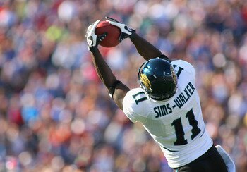 ORCHARD PARK, NY - OCTOBER 10:  Mike Sims-Walker #11 of the Jacksonville Jaguars makes a catch against the Buffalo Bills   at Ralph Wilson Stadium on October 10, 2010 in Orchard Park, New York. Jacksonville won 36-26. (Photo by Rick Stewart/Getty Images)