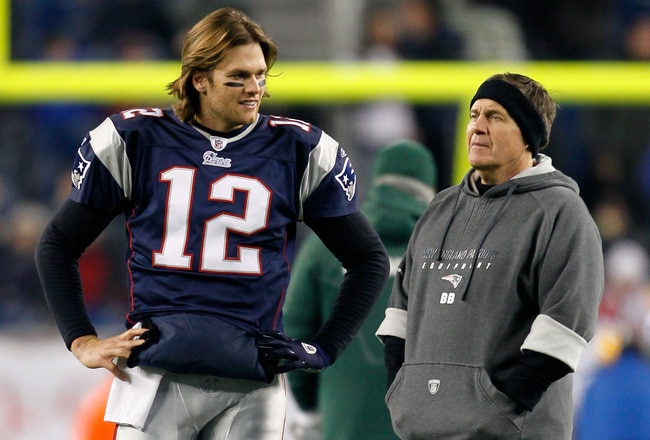 FOXBORO, MA - DECEMBER 19:  Quarterback Tom Brady #12 of the New England Patriots talks with head coach Bill Belichick before playing against the Green Bay Packers at Gillette Stadium on December 19, 2010 in Foxboro, Massachusetts.  The Patriots won the g