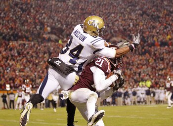 BLACKSBURG, VA - NOVEMBER 04:  Cornerback Rashad Carmichael #21 of the Virginia Tech Hokies intercepts a pass in the end zone in the final seconds intended for wide receiver Tyler Melton #84 of the Georgia Tech Yellow Jackets at Lane Stadium on November 4