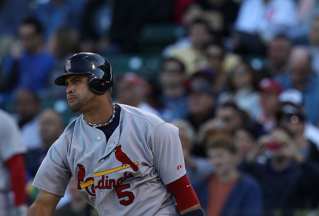 CHICAGO - SEPTEMBER 24: Albert Pujols #5 of the St. Louis Cardinals hits a single in the 9th inning against the Chicago Cubs at Wrigley Field on September 24, 2010 in Chicago, Illinois. The Cardinals defeated the Cubs 7-1. (Photo by Jonathan Daniel/Getty