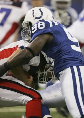 INDIANAPOLIS - NOVEMBER 12:  Robert Mathis #98 of the Indianapolis Colts sacks J.P. Losman #7 of the Buffalo Bills on November 12, 2006 at the RCA Dome in Indianapolis, Indiana. (Photo by Jonathan Daniel/Getty Images)