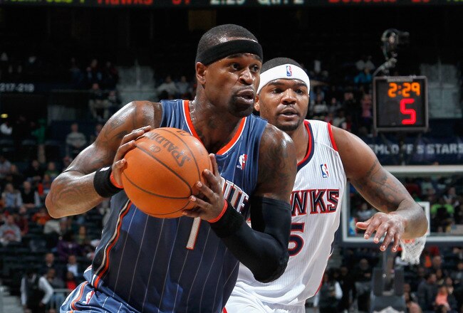ATLANTA, GA - FEBRUARY 12:  Stephen Jackson #1 of the Charlotte Bobcats drives past Josh Smith #5 of the Atlanta Hawks at Philips Arena on February 12, 2011 in Atlanta, Georgia.  NOTE TO USER: User expressly acknowledges and agrees that, by downloading an