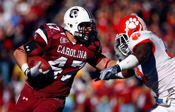 COLUMBIA, SC - NOVEMBER 28:  Patrick DiMarco #47 of the South Carolina Gamecocks fights off the tackle of Kavell Conner #33 of the Clemson Tigers at Williams-Brice Stadium on November 28, 2009 in Columbia, South Carolina.  (Photo by Scott Halleran/Getty I