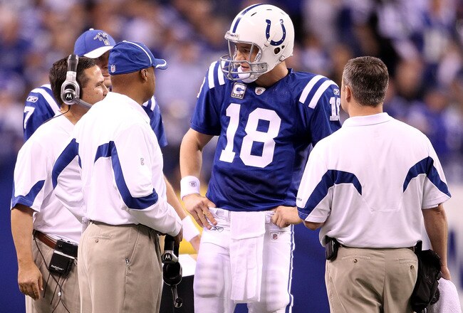 INDIANAPOLIS, IN - JANUARY 08:  Quarterback Peyton Manning #18 of the Indianapolis Colts talks with head coach Jim Caldwell against the New York Jets during their 2011 AFC wild card playoff game at Lucas Oil Stadium on January 8, 2011 in Indianapolis, Ind