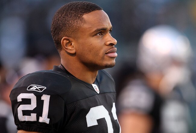 OAKLAND, CA - NOVEMBER 28:  Nnamdi Asomugha #21 of the Oakland Raiders stands on the sidelines during the closing minutes of their loss to the Miami Dolphins at Oakland-Alameda County Coliseum on November 28, 2010 in Oakland, California.  (Photo by Ezra S
