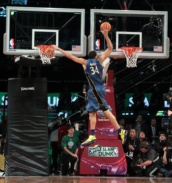 LOS ANGELES, CA - FEBRUARY 19:  JaVale McGee #34 of the Washington Wizards dunks two balls on the same jump in the first round of the Sprite Slam Dunk Contest apart of NBA All-Star Saturday Night at Staples Center on February 19, 2011 in Los Angeles, Cali