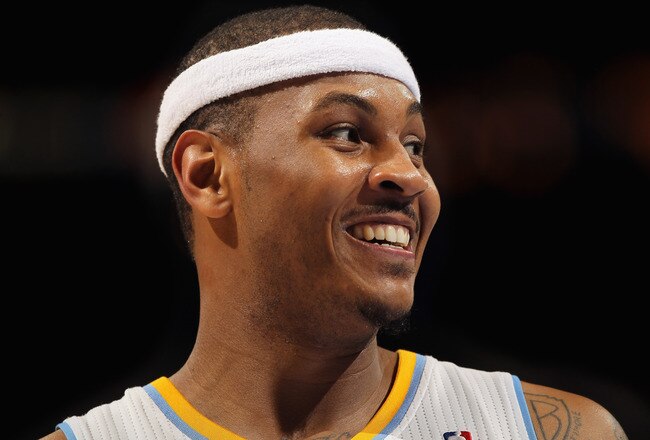 DENVER, CO - FEBRUARY 10:  Carmelo Anthony #15 of the Denver Nuggets looks on during a break in the action against the Dallas Mavericks during NBA action at the Pepsi Center on February 10, 2011 in Denver, Colorado. The Nuggets defeated the Mavericks 121-