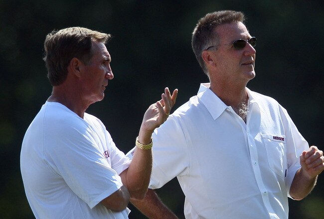 ASHBURN, VA - JULY 30:  Head coach Mike Shanahan (L) of the Washington Redskins speaks with general manager Bruce Allen during the second day of training camp July 30, 2010 in Ashburn, Virginia.  (Photo by Win McNamee/Getty Images)