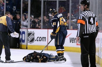 BUFFALO, NY - MARCH 25:  Maxim Afinogenov #61 of the Buffalo Sabres stands over Derek Roy #9, who was injured during the game against the Ottawa Senators on March 25, 2008 at HSBC Arena in Buffalo, New York. (Photo by Rick Stewart/Getty Images)