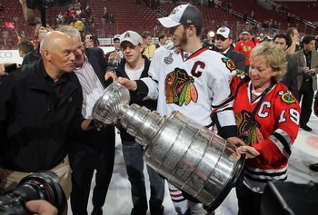 PHILADELPHIA - JUNE 09:  Jonathan Toews #19 of the Chicago Blackhawks hoists the Stanley Cup after teammate Patrick Kane scored the game-winning goal in overtime to defeat the Philadelphia Flyers 4-3 and win the Stanley Cup in Game Six of the 2010 NHL Sta
