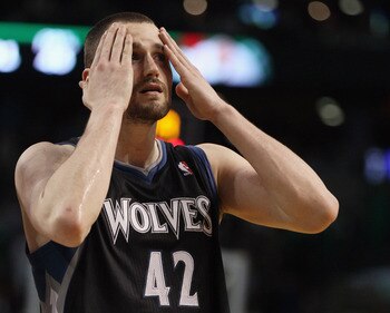 BOSTON, MA - JANUARY 03:  Kevin Love #42 of the Minnesota Timberwolves wipes his face in the fourth quarter against the Boston Celtics on January 3, 2011 at the TD Garden in Boston, Massachusetts. The Celtics defeated the Timberwolves 96-93. NOTE TO USER: