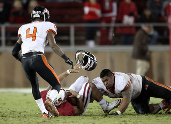 PALO ALTO, CA - NOVEMBER 27:  Stephen Paea #54 of the Oregon State Beavers loses his helmet as he tackles Tyler Gaffney #25 of the Stanford Cardinal at Stanford Stadium on November 27, 2010 in Palo Alto, California.  (Photo by Ezra Shaw/Getty Images)