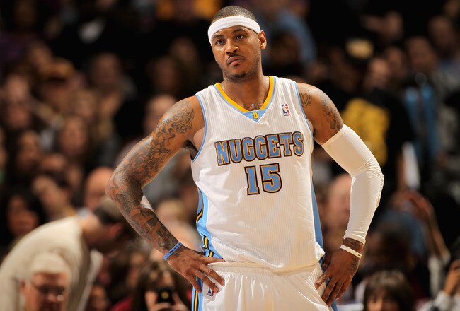 DENVER, CO - JANUARY 21:  Carmelo Anthony #15 of the Denver Nuggets looks on during a break in the action against the Los Angeles Lakers at the Pepsi Center on January 21, 2011 in Denver, Colorado. The Lakers defeated the Nuggets 107-97. NOTE TO USER: Use
