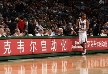 MILWAUKEE - JANUARY 22:  Michael Redd of the Milwaukee Bucks walks in front of the scores' table as he gets set to check back into the game against the Phoenix Suns at the Bradley Center on January 22, 2008 in Milwaukee, Wisconsin.  NOTE TO USER: User exp