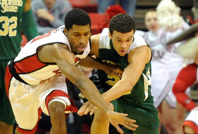LAS VEGAS, NV - JANUARY 19:  Justin Hawkins #31 of the UNLV Rebels tries to steal the ball from Dorian Green #22 of the Colorado State Rams during their game at the Thomas & Mack Center January 19, 2011 in Las Vegas, Nevada.  (Photo by Ethan Miller/Getty