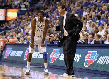 LEXINGTON, KY - JANUARY 29:  John Calipari the Head Coach of the Kentucky Wildcats gives instructions to Brandon Knight #12 during the SEC game against the Georgia Bulldogs at Rupp Arena on January 29, 2011 in Lexington, Kentucky. Kentucky won 66-60.  (Ph