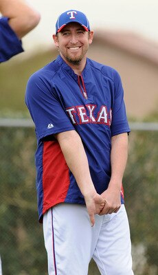 SURPRISE, AZ - FEBRUARY 18:  Brandon Webb #33 of the Texas Rangers stretches prior to spring work outs at Surprise Stadium on February 18, 2011 in Surprise, Arizona.  (Photo by Norm Hall/Getty Images)