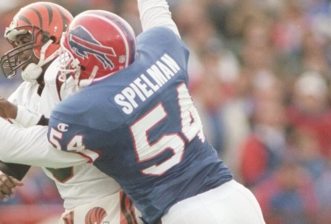 17 Nov 1996: Quarterback Jeff Blake of the Cincinnati Bengals is sacked by linebacker Chris Spielman of the Buffalo Bills during the Bengals 31-17 loss to the Buffalo Bills at Rich Stadium in Orchard Park, New York.