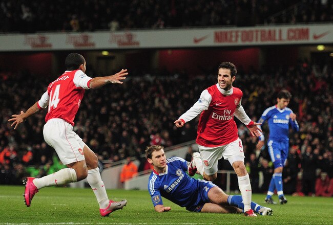 LONDON, ENGLAND - DECEMBER 27:  Cesc Fabregas of Arsenal celebrates Arsenal's second goal with Theo Walcott (L) during the Barclays Premier League match between Arsenal and Chelsea at the Emirates Stadium on December 27, 2010 in London, England.  (Photo b