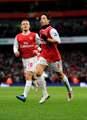 LONDON, ENGLAND - DECEMBER 04:  Samir Nasri (L) of Arsenal celebrates with teammate Jack Wilshere after scoring the opening goal during the Barclays Premier League match between Arsenal and Fulham at the Emirates Stadium on December 4, 2010 in London, Eng