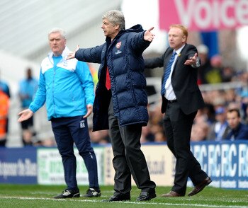 BIRMINGHAM, ENGLAND - MARCH 27:  Arsene Wenger of Arsenal makes his feelings known from the touchline in front of Alex McLeish of Birmingham City during the Barclays Premier League match between Birmingham City and Arsenal at St. Andrews Stadium on March