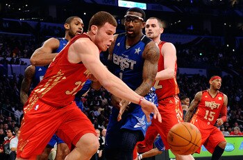 LOS ANGELES, CA - FEBRUARY 20:  Blake Griffin #32 of the Los Angeles Clippers and the Western Conference moves the ball against Amare Stoudemire #1 of the New York Knicks and the Eastern Conference in the 2011 NBA All-Star Game at Staples Center on Februa