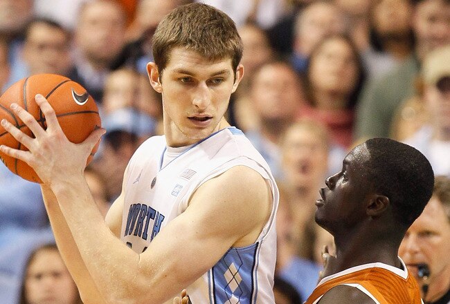 GREENSBORO, NC - DECEMBER 18:  Tyler Zeller #44 of the North Carolina Tar Heels against Alexis Wangmene #20 of the Texas Longhorns at Greensboro Coliseum on December 18, 2010 in Greensboro, North Carolina.  (Photo by Kevin C. Cox/Getty Images)
