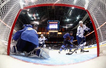 ATLANTA, GA - FEBRUARY 27:  Phil Kessel #81 of the Toronto Maple Leafs scores a goal against goaltender Chris Mason #50 and Mark Stuart #5 of the Atlanta Thrashers at Philips Arena on February 27, 2011 in Atlanta, Georgia.  (Photo by Kevin C. Cox/Getty Im