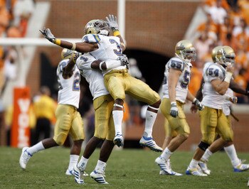 KNOXVILLE, TN - SEPTEMBER 12: Rahim Moore #3 and Alterraun Verner #1 of the UCLA Bruins celebrate at the end of the game against the Tennessee Volunteers on September 12, 2009 at Neyland Stadium in Knoxville, Tennessee. The Bruins beat the Volunteers 19-1