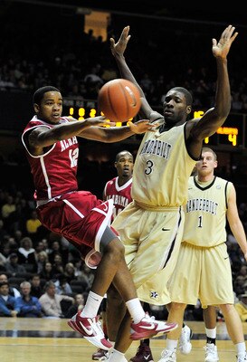 NASHVILLE, TN - FEBRUARY 10:  Trevor Releford #13 of the Alabama Crimson Tide drives against Festus Ezeli #3 of the Vanderbilt Commodores at Memorial Gym on February 10, 2011 in Nashville, Tennessee.  (Photo by Grant Halverson/Getty Images)