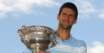 MELBOURNE, AUSTRALIA - JANUARY 31:  Novak Djokovic of Serbia poses with the Norman Brookes Challenge Cup at the Melbourne Cricket Ground on January 31, 2011 in Melbourne, Australia.  (Photo by Mark Dadswell/Getty Images)