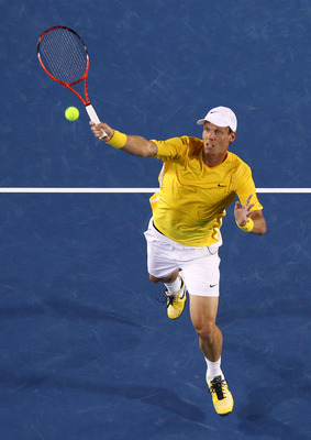 MELBOURNE, AUSTRALIA - JANUARY 25:  Tomas Berdych of the Czech Republic plays a forehand in his quarterfinal match against Novak Djokovic of Serbia during day nine of the 2011 Australian Open at Melbourne Park on January 25, 2011 in Melbourne, Australia.