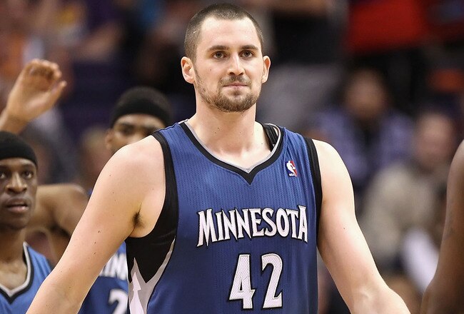 PHOENIX - DECEMBER 15:  Kevin Love #42 of the Minnesota Timberwolves high fives teammate Martell Webster #5 during the NBA game against the Phoenix Suns at US Airways Center on December 15, 2010 in Phoenix, Arizona.  The Suns defeated the Timberwolves 128