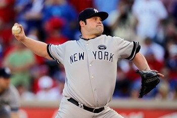 ARLINGTON, TX - OCTOBER 16:  Joba Chamberlain #62 of the New York Yankees throws a pitch against the Texas Rangers in Game Two of the ALCS during the 2010 MLB Playoffs at Rangers Ballpark in Arlington on October 16, 2010 in Arlington, Texas.  (Photo by St